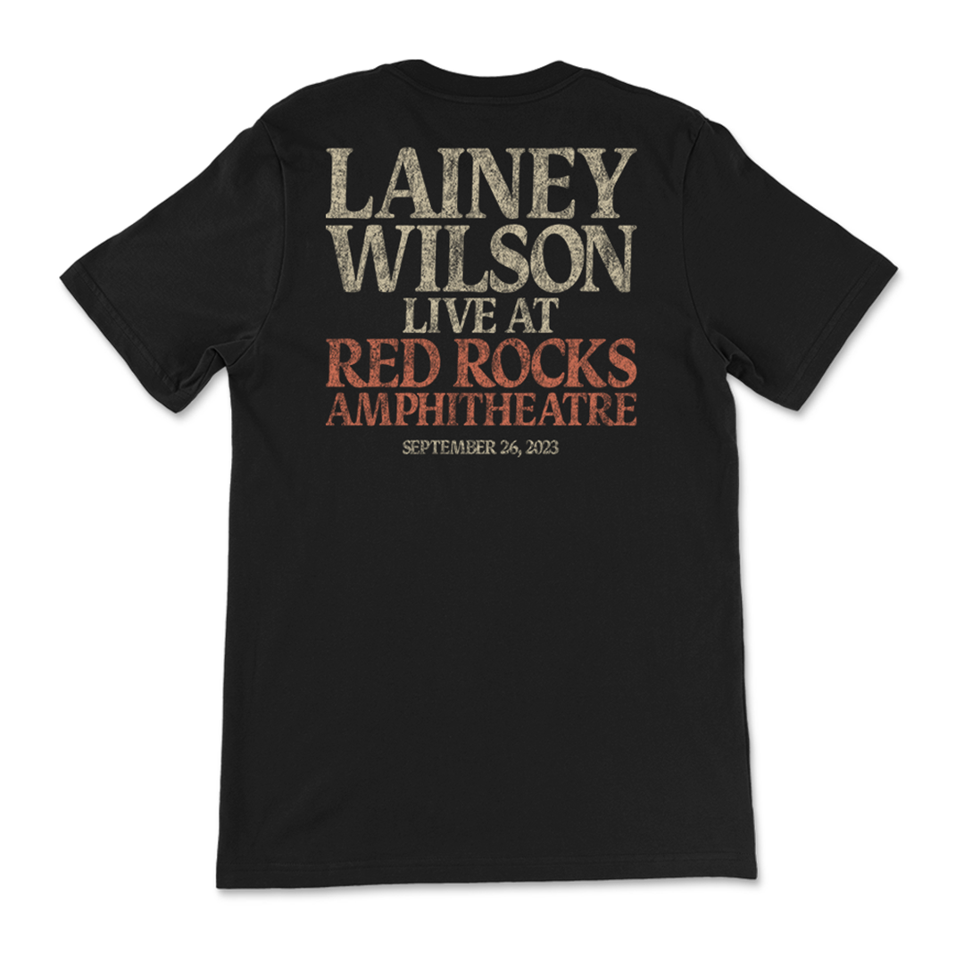 Black t-shirt with text advertising a Lainey Wilson concert at Red Rocks Amphitheatre on September 26, 2023.