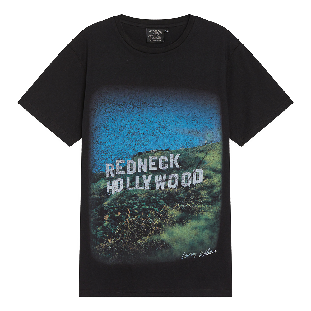 Black t-shirt featuring a graphic design of ’Redneck Hollywood’ text over a hillside landscape.