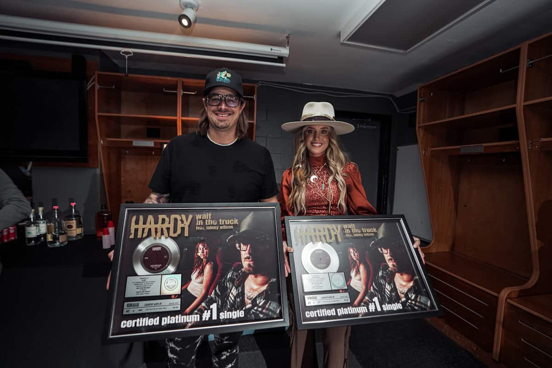 Platinum Surprise: HARDY and Lainey Wilson Receive Plaque For ‘Wait in the Truck’ Ahead Of Tour Kickoff