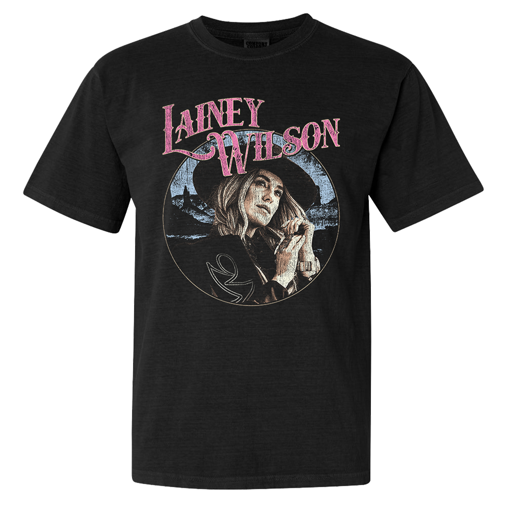 Official Lainey Wilson Merchandise. Black, 100% cotton heavy weight t-shirt with a full color desert photo of Lainey Wilson and a pink logo.&nbsp;