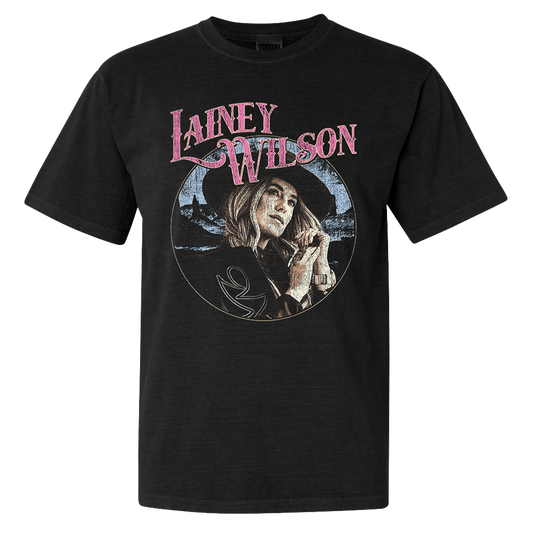 Official Lainey Wilson Merchandise. Black, 100% cotton heavy weight t-shirt with a full color desert photo of Lainey Wilson and a pink logo.&nbsp;