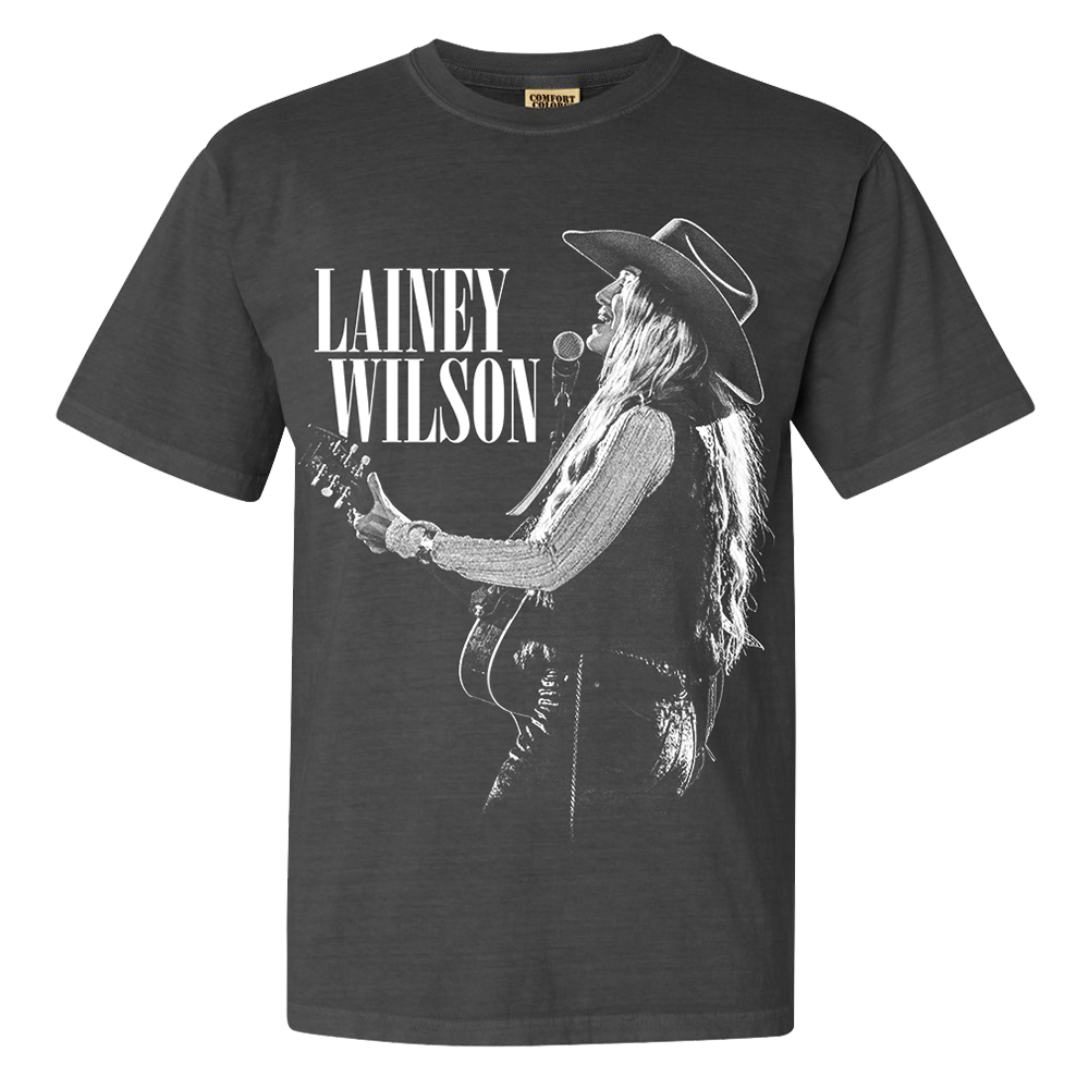 Official Lainey Wilson Merchandise. Dark grey, 100% cotton heavy weight t-shirt with a black and white live photo of Lainey Wilson.