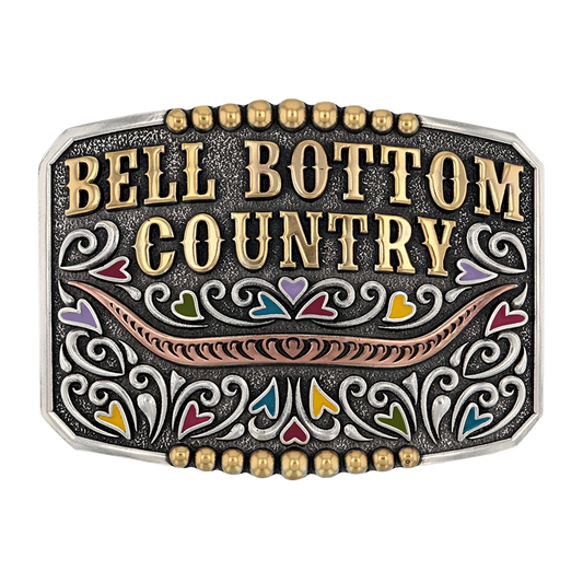 Ornate belt buckle with ’Bell Bottom Country’ text and colorful decorative elements.