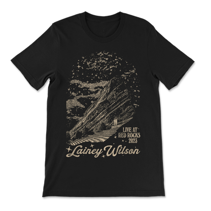 Black t-shirt with a metallic graphic design featuring Red Rocks amphitheater and ’Lainey Wilson Live at Red Rocks 2023’ text.