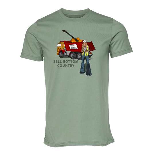 Sage green t-shirt with a ’Bell Bottom Country’ graphic design featuring a dump truck and a 1970s-style woman.