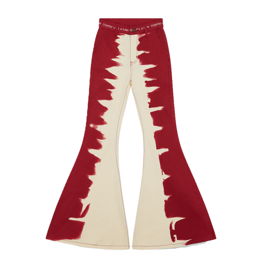 Red and cream-colored flared pants with a jagged pattern design.
