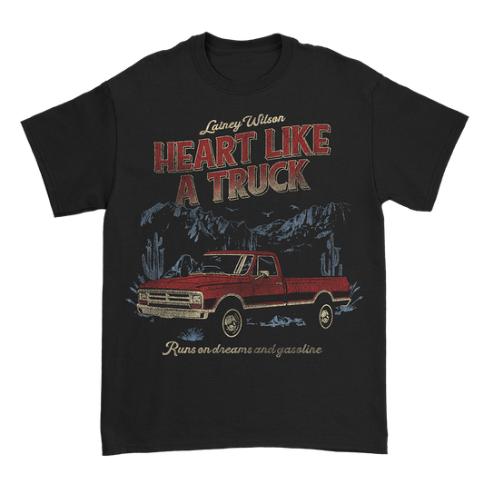Black t-shirt with a vintage-style graphic design featuring a red pickup truck and text.